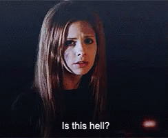 A Woman Is Asking Is This Hell ? In A Dark Room . GIF