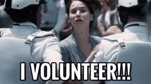 A Woman Is Being Held By A Group Of Police Officers And Says `` I Volunteer !! '' GIF