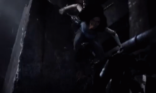 A Woman Is Being Pulled By A Rope In A Dark Room And Screaming . GIF