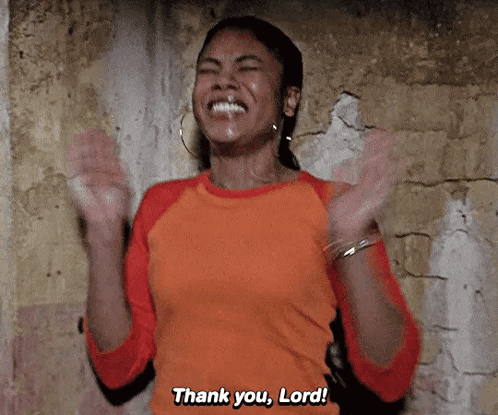 A Woman Is Clapping Her Hands And Saying Thank You Lord . GIF