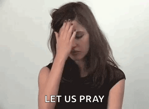 A Woman Is Covering Her Face With Her Hand And The Words `` Let Us Pray '' Are Behind Her . GIF