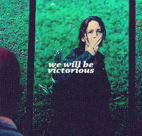 A Woman Is Covering Her Mouth With Her Hand And The Words We Will Be Victorious GIF