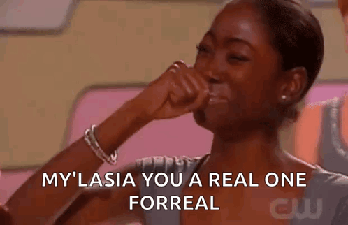 A Woman Is Covering Her Mouth With Her Hand While Laughing And Saying `` My Lasia You A Real One Forreal '' . GIF