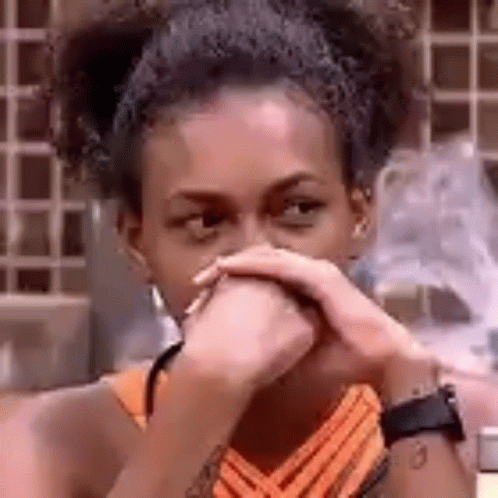 Woman Covering Mouth With Hands Looking At Camera GIF