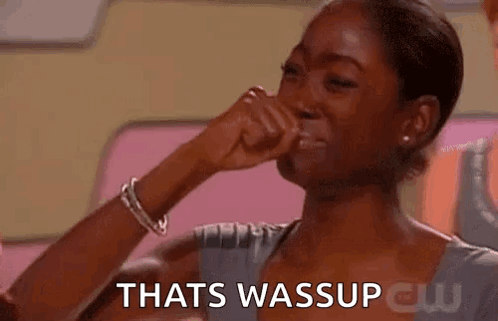 A Woman Is Covering Her Nose With Her Hand While Crying . GIF