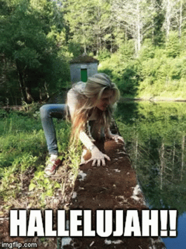 A Woman Is Crawling On A Rock Near A Body Of Water With The Caption Hallelujah ! GIF