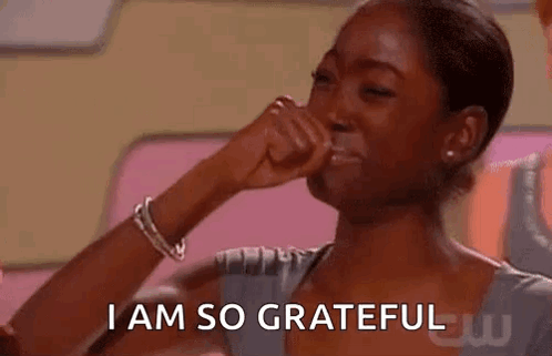 A Woman Is Crying And Covering Her Face With Her Hand . GIF