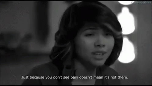 A Woman Is Crying In A Black And White Photo With A Quote That Says Just Because You Don 'T See Pain GIF