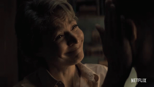 A Woman Is Crying In Front Of A Man With Netflix Written On The Bottom GIF
