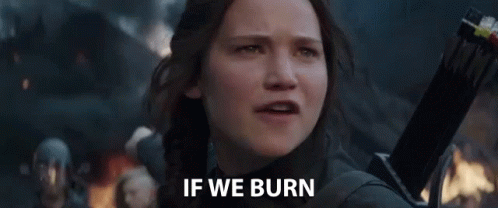 A Woman Is Crying While Holding A Sword And The Words `` If We Burn '' Are Written On Her Face . GIF
