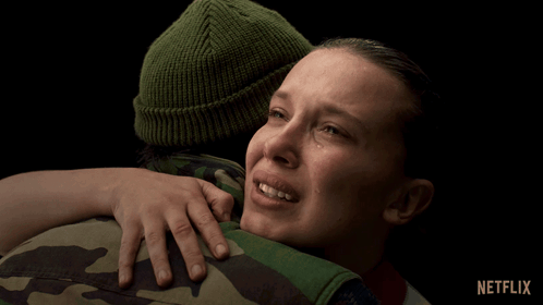 A Woman Is Crying While Hugging A Man With Netflix Written On The Bottom Right GIF