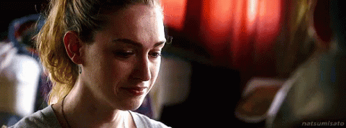 A Woman Is Crying While Looking At Another Woman . GIF