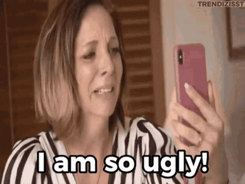 A Woman Is Crying While Looking At Her Phone And Says I Am So Ugly . GIF
