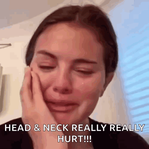 A Woman Is Crying With Her Hand On Her Face And The Caption Reads Head & Neck Really Really Hurt GIF