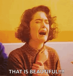 A Woman Is Crying With Her Mouth Open And The Words `` That Is Beautiful '' Written Next To Her . GIF