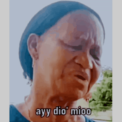 A Woman Is Crying With The Words Ayy Dio Mioo Written On Her Face . GIF