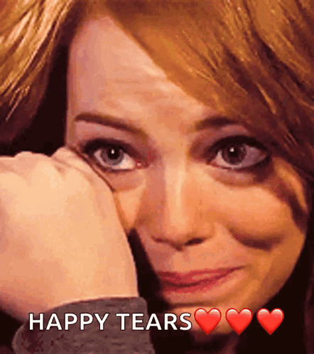 A Woman Is Crying With The Words Happy Tears Written Below Her GIF