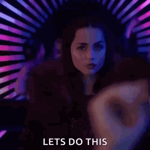 A Woman Is Dancing In A Club With The Words Let 'S Do This Written Below Her . GIF