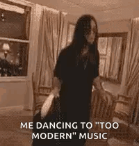 A Woman Is Dancing In A Living Room While Holding A Bag . GIF