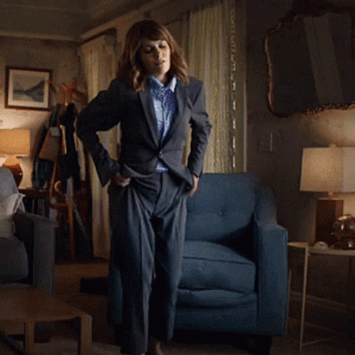 Woman Dancing In Living Room With Blue Chair GIF