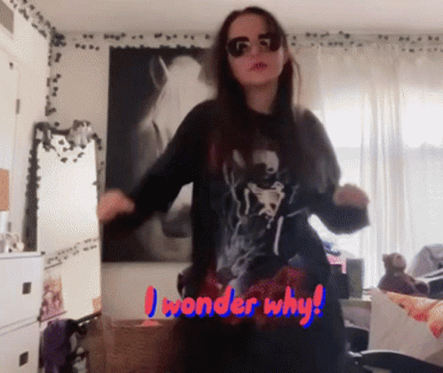 A Woman Is Dancing In A Room With The Words " I Wonder Why " Written On The Bottom GIF