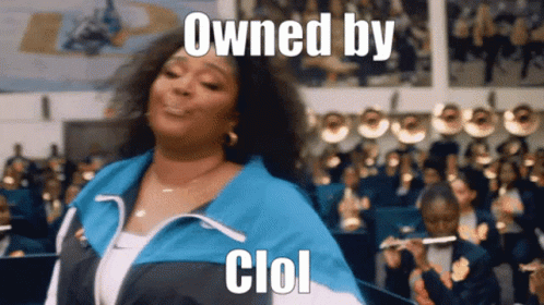 A Woman Is Dancing In Front Of A Band With The Words " Owned By Clol " Written On Her Face GIF