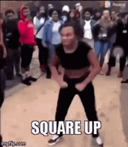 A Woman Is Dancing In Front Of A Crowd Of People With The Words `` Square Up '' Written On The Bottom . GIF