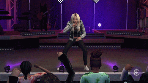 A Woman Is Dancing On A Stage In Front Of A Crowd With A Dollar Sign In The Lower Right Corner GIF