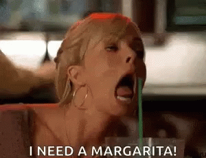 A Woman Is Drinking A Margarita With A Straw And Says `` I Need A Margarita ! '' GIF