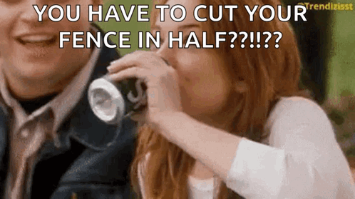 a woman is drinking a soda from a can and a man is laughing behind her .