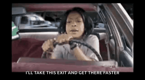 A Woman Is Driving A Car With The Words `` I 'Ll Take This Exit And Get There Faster '' On The Screen . GIF