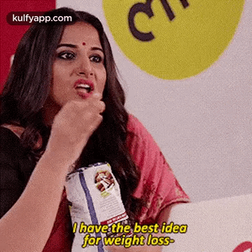 A Woman Is Eating A Bag Of Chips And Saying `` I Have The Best Idea For Weight Loss . '' GIF