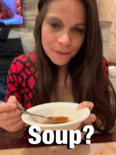 A Woman Is Eating A Bowl Of Soup With The Words Soup Written Below Her GIF