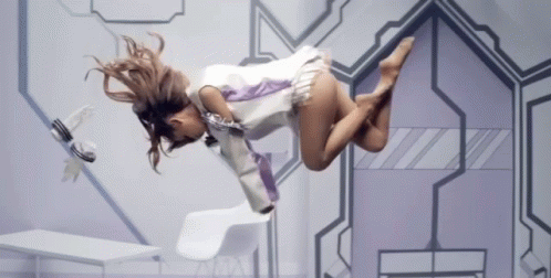 A Woman Is Flying Through The Air In A Futuristic Setting GIF