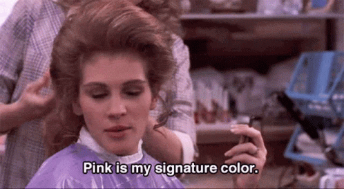 A Woman Is Getting Her Hair Done By A Hairdresser And Says `` Pink Is My Signature Color '' . GIF
