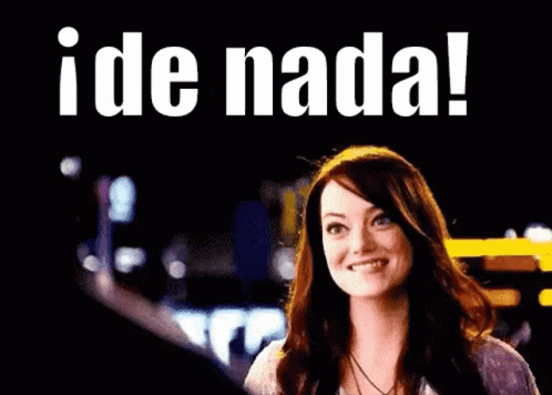 A Woman Is Giving A Thumbs Up In Front Of A Sign That Says Ide Nada ! GIF