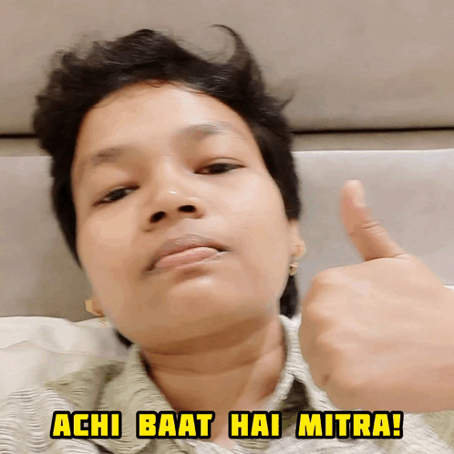 A Woman Is Giving A Thumbs Up With The Words Achi Baat Hai Mitra Below Her GIF