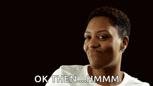 A Woman Is Giving A Thumbs Up With The Words Ok Then Hmmm Behind Her GIF