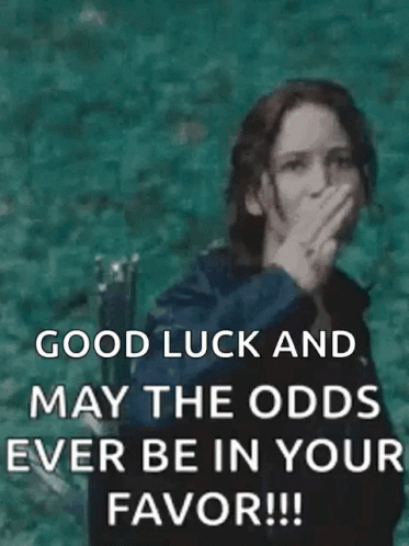 A Woman Is Giving The Middle Finger And Saying `` Good Luck And May The Odds Ever Be In Your Favor !! '' GIF