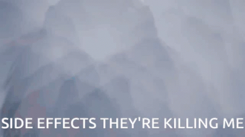 A Woman Is Hanging Upside Down With The Words Side Effects They 'Re Killing Me GIF
