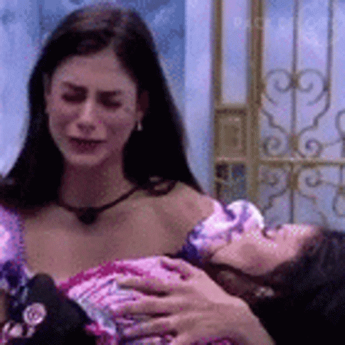 Woman Holding Baby Watching Another Woman GIF