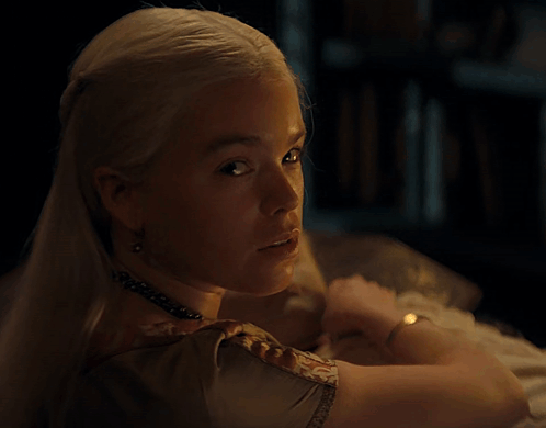 A Woman Is Holding A Baby Who Is Sleeping GIF