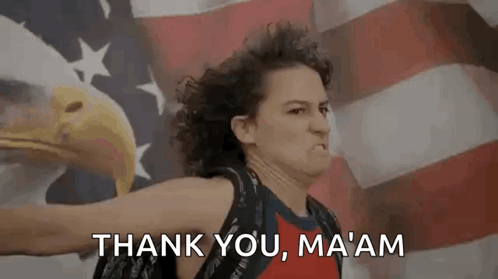 A Woman Is Holding A Bald Eagle In Front Of An American Flag And Saying `` Thank You , Ma Am '' . GIF