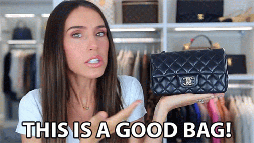 A Woman Is Holding A Black Chanel Purse And Says " This Is A Good Bag " GIF