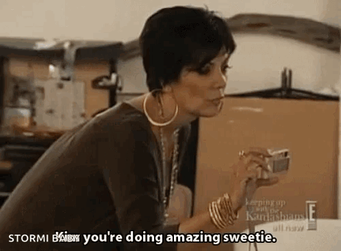 A Woman Is Holding A Camera In Her Hand And Says " Stormi Baby You 'Re Doing Amazing Sweetie " GIF