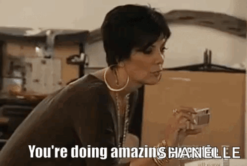 A Woman Is Holding A Cell Phone And Saying `` You 'Re Doing Amazing Chanelle '' . GIF