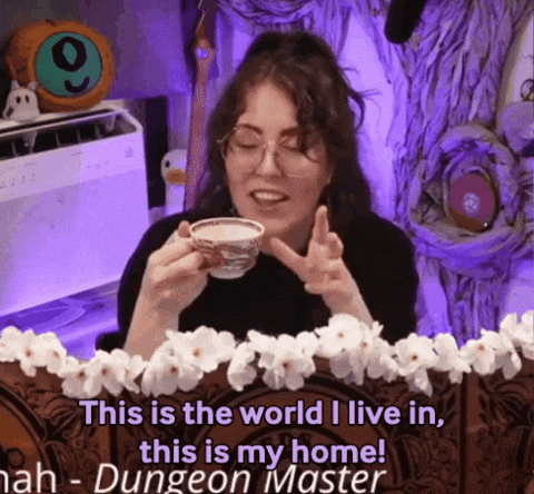 A Woman Is Holding A Cup Of Coffee And Says " This Is The World I Live In This Is My Home ! " GIF