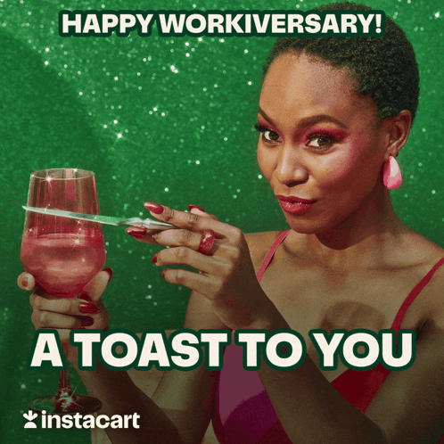 A Woman Is Holding A Glass Of Wine And A Pair Of Scissors And Says Happy Workiversary GIF