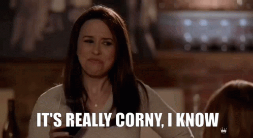 A Woman Is Holding A Glass Of Wine And Saying It 'S Really Corny I Know . GIF