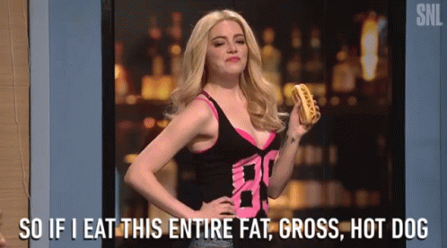 A Woman Is Holding A Hot Dog And Saying `` So If I Eat This Entire Fat , Gross , Hot Dog '' GIF